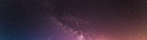 milky way above body of water